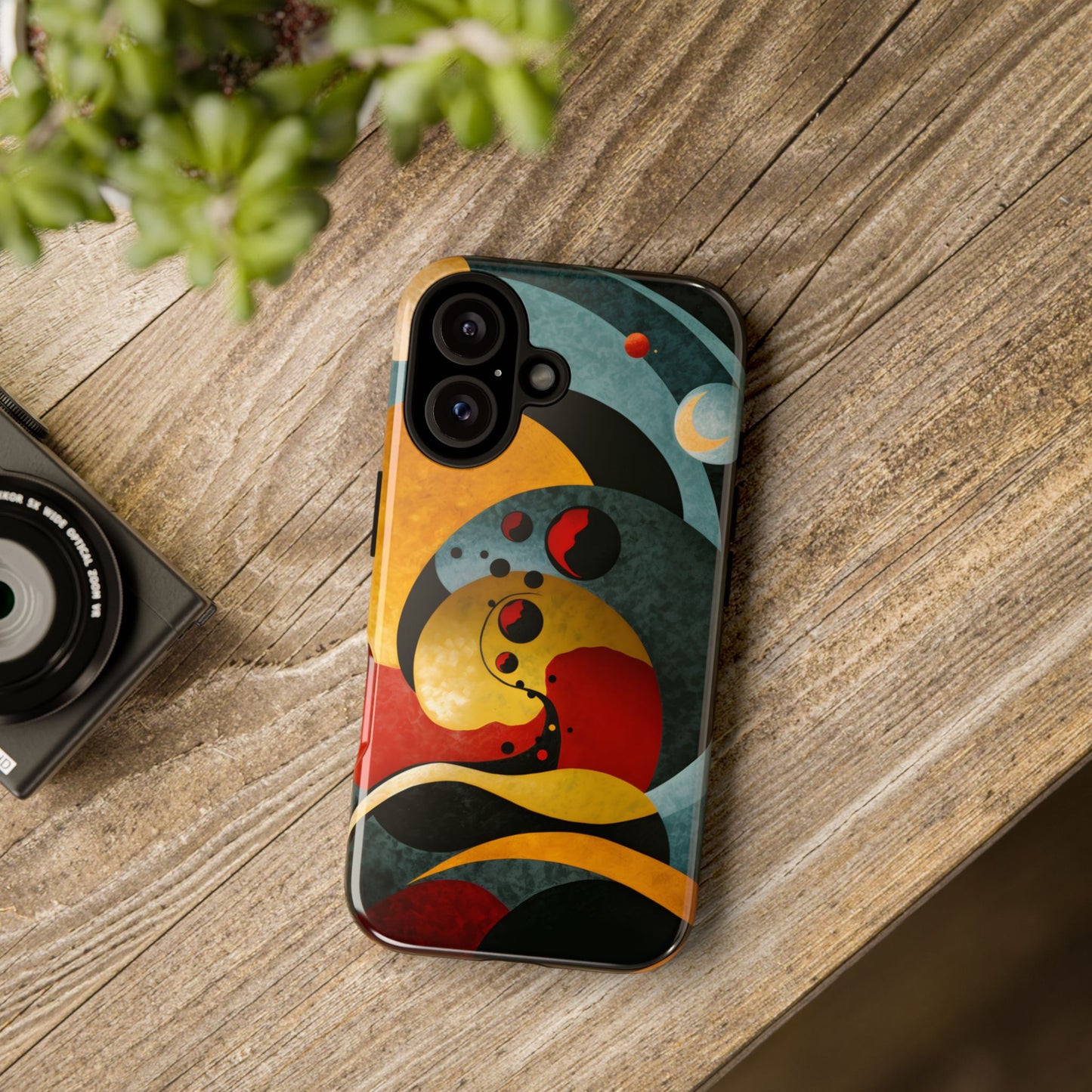 Molecular Moons phone case featuring abstract celestial spheres and flowing geometric forms in deep blue, gold, red, and black tones, evoking cosmic motion, mystery, and exploration.