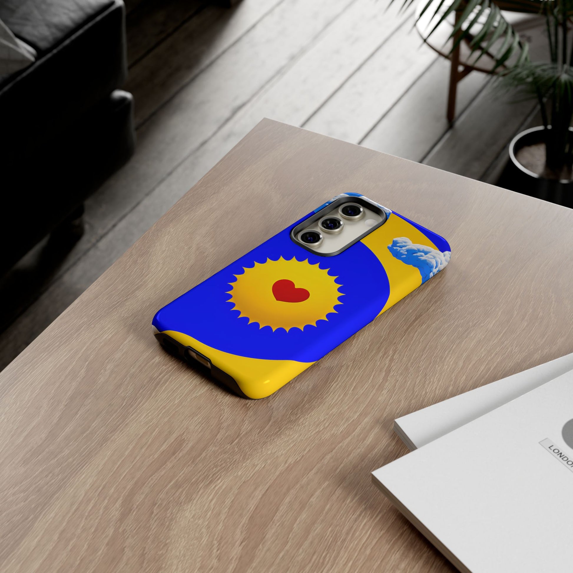 Sunshine Heart tough phone case — yellow sun with red heart on vibrant blue and yellow background by Expressive Phone Cases