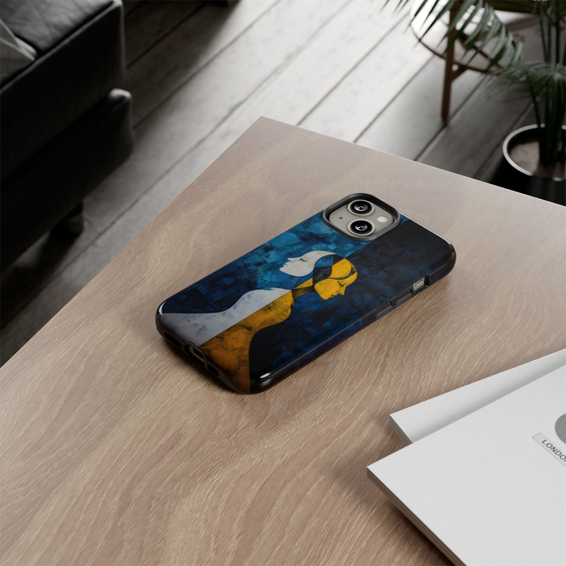 Gemini zodiac phone case featuring stylized twin figures rendered in gold and ivory against a richly textured midnight blue background, symbolizing the dual nature of Gemini.