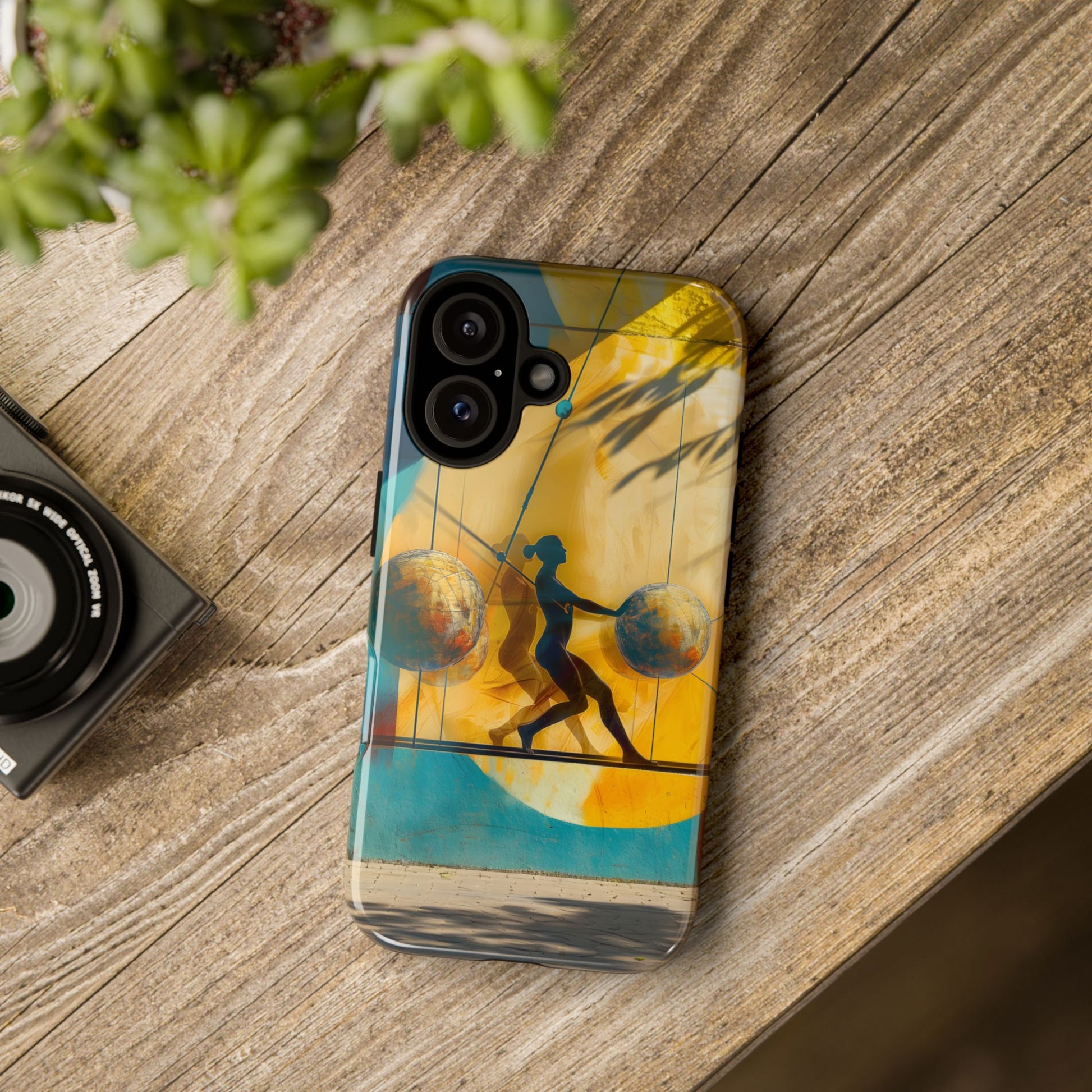Tightrope Phone Case
Artistic phone case featuring a silhouetted figure balancing between two globe-like spheres against a golden backdrop, symbolizing balance, resilience, and life's challenges.